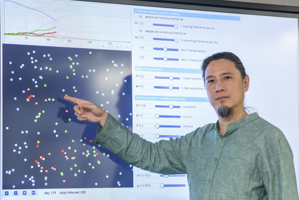 De Kai, Professor of Computer Science and Engineering, demonstrates how the interactive visualization of the simulation works.