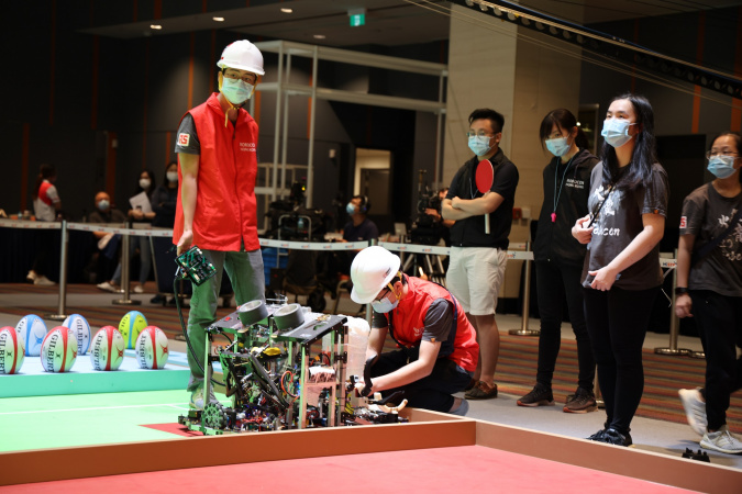 The contest was to play rugby game using two robots and five obstacles as five defending players.